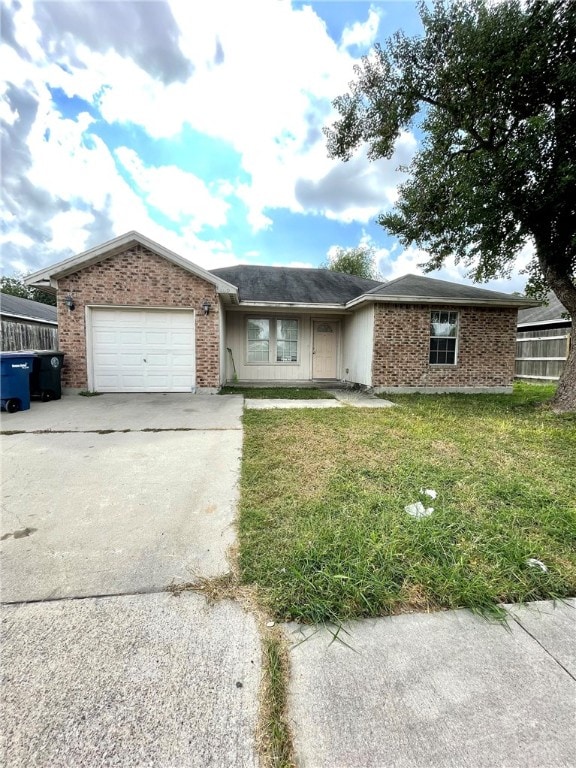 ranch-style home with a garage and a front yard