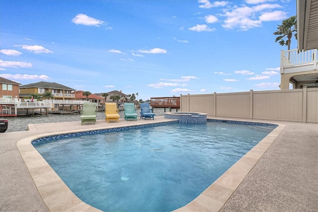 view of swimming pool featuring a patio area