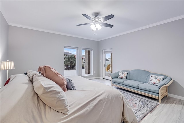 bedroom with light wood-type flooring, ceiling fan, and crown molding