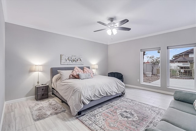 bedroom featuring ceiling fan and crown molding