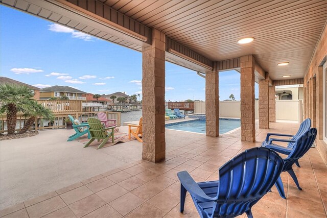 view of patio with a fenced in pool