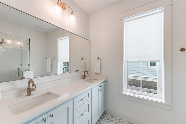 bathroom with vanity and walk in shower