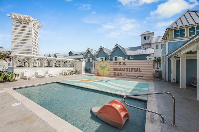 view of swimming pool with a patio area