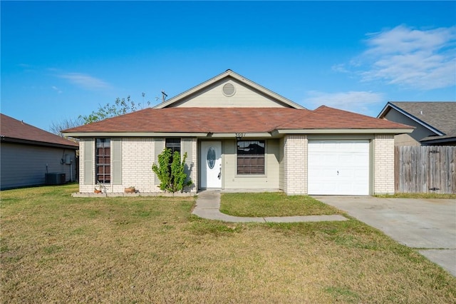 ranch-style home featuring a front yard, a garage, and cooling unit