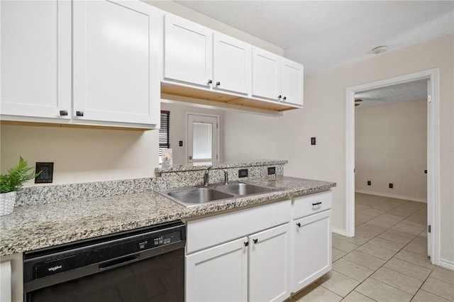 kitchen with white cabinetry, dishwasher, and sink