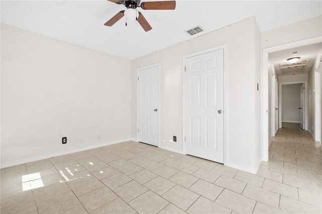 unfurnished bedroom with ceiling fan and light tile patterned floors