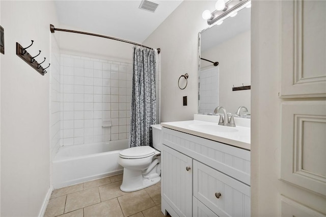 full bathroom featuring toilet, shower / bath combo, vanity, and tile patterned floors