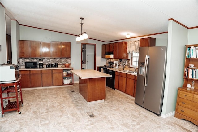 3081 Hackberry Ave, Ingleside, TX 78362 - kitchen featuring black appliances, ornamental molding, light countertops, tasteful backsplash, and vaulted ceiling