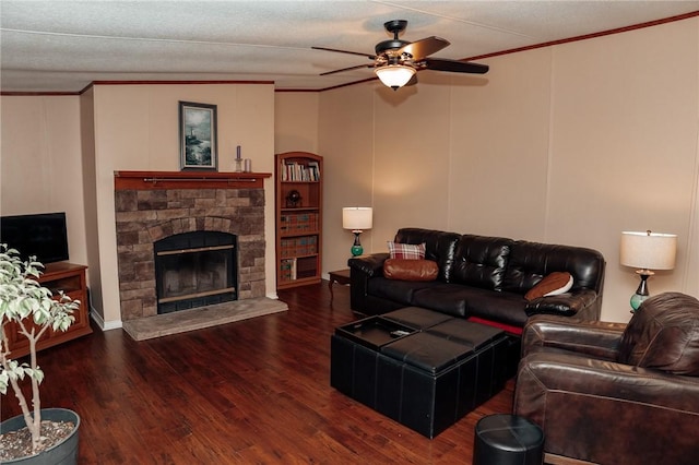 3081 Hackberry Ave, Ingleside, TX 78362 - living area featuring crown molding, ceiling fan, wood finished floors, and a stone fireplace