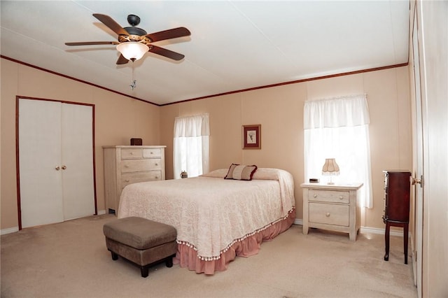 3081 Hackberry Ave, Ingleside, TX 78362 - bedroom featuring crown molding, lofted ceiling, light colored carpet, a closet, and ceiling fan
