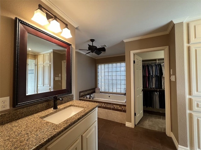 bathroom with a relaxing tiled tub, ceiling fan, vanity, and crown molding