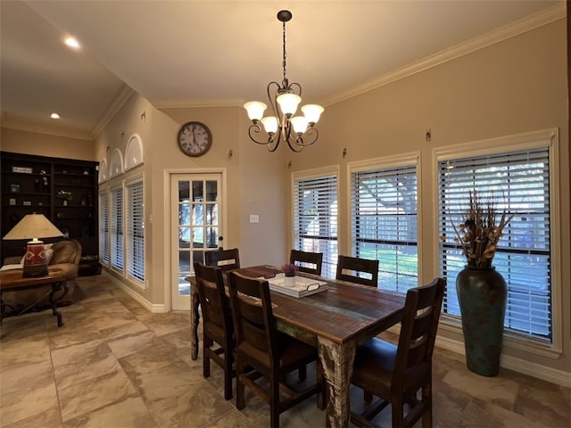 dining space featuring a chandelier and crown molding