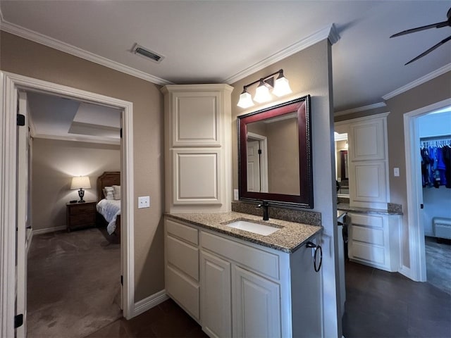 bathroom featuring ceiling fan, vanity, and crown molding