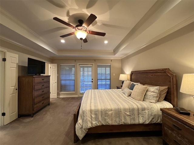 carpeted bedroom with ornamental molding, access to exterior, ceiling fan, and a raised ceiling