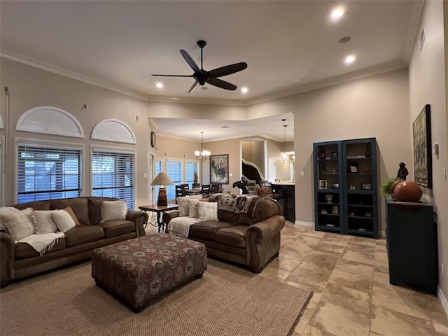 living room featuring ornamental molding and ceiling fan with notable chandelier