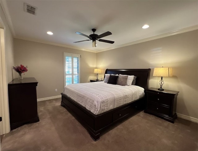 bedroom featuring ornamental molding, dark colored carpet, and ceiling fan