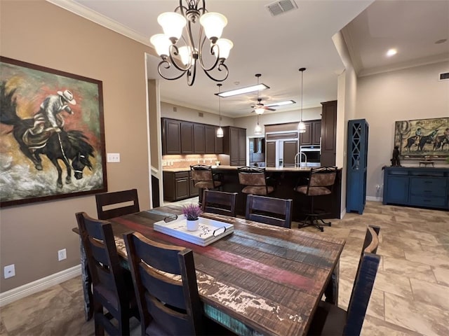 dining area with crown molding and ceiling fan with notable chandelier