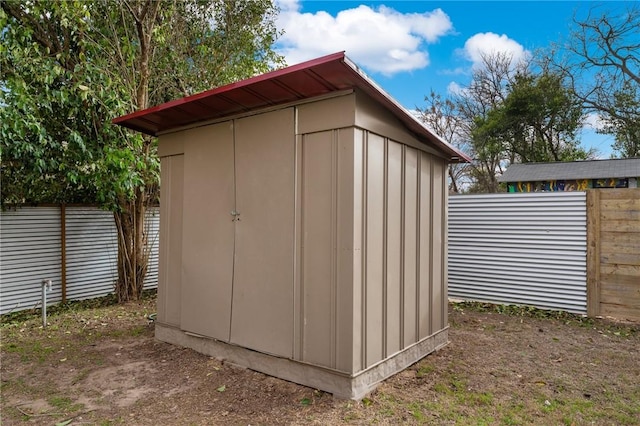 view of shed featuring a fenced backyard
