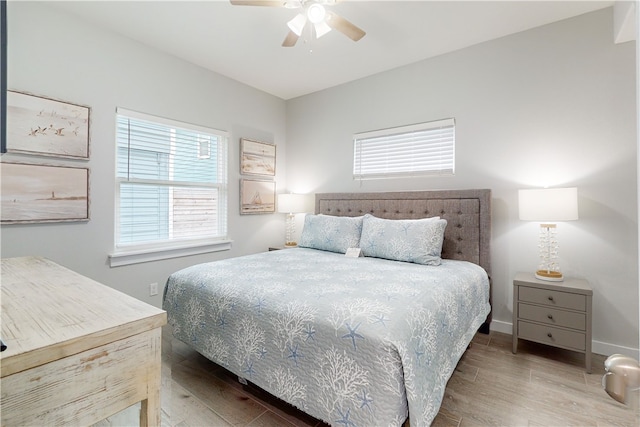 bedroom with hardwood / wood-style floors and ceiling fan