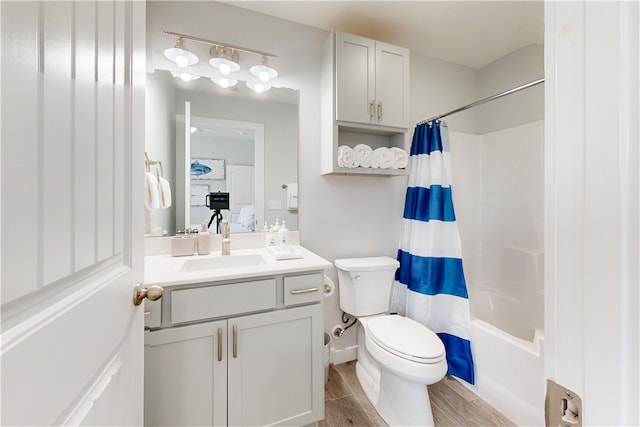 full bathroom with toilet, vanity, shower / bath combination with curtain, and wood-type flooring