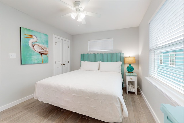 bedroom featuring a closet, hardwood / wood-style flooring, and ceiling fan