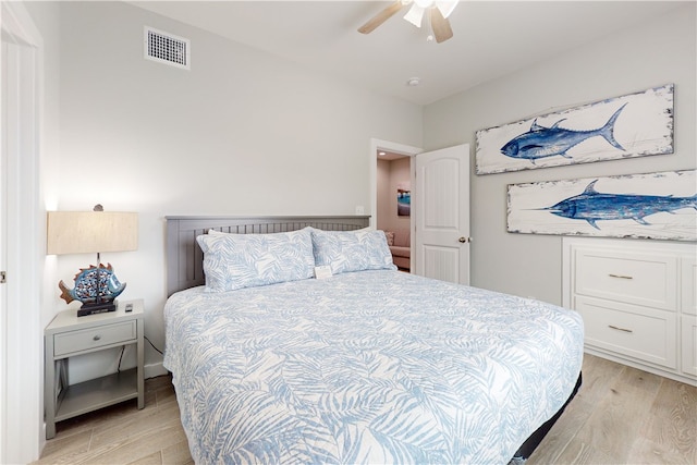 bedroom featuring ceiling fan and light hardwood / wood-style flooring