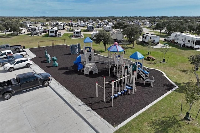 67 Augusta Cir, Aransas Pass, TX 78336 - community playground featuring a lawn