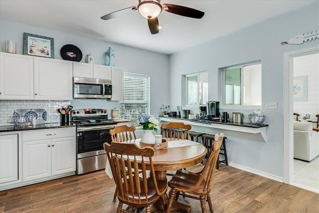 67 Augusta Cir, Aransas Pass, TX 78336 - dining area featuring a ceiling fan and light wood-type flooring