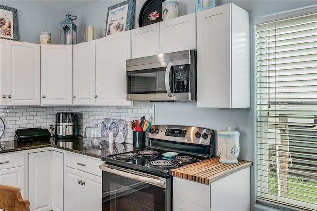 67 Augusta Cir, Aransas Pass, TX 78336 - kitchen featuring stainless steel appliances, tasteful backsplash, and white cabinetry