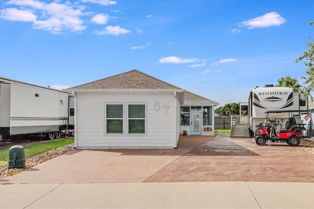 67 Augusta Cir, Aransas Pass, TX 78336 - rear view of property with a shingled roof