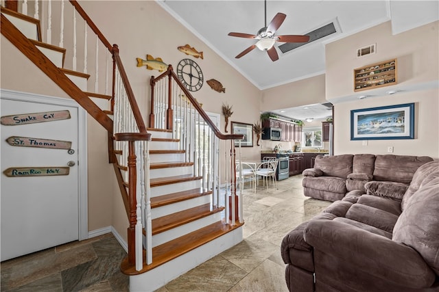 living room featuring ceiling fan, high vaulted ceiling, and ornamental molding