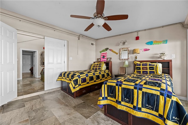 bedroom featuring ceiling fan and a closet