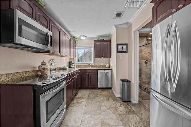 kitchen featuring sink, appliances with stainless steel finishes, and ornamental molding