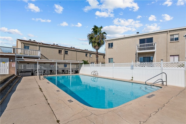 view of swimming pool with a patio area