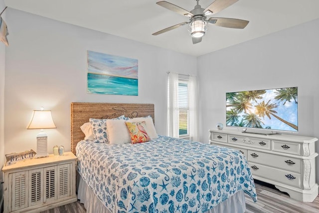 bedroom featuring ceiling fan and light hardwood / wood-style flooring