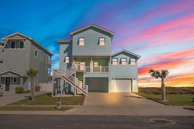 beach home featuring a porch and a garage