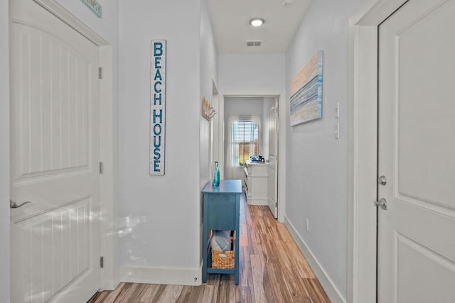 hallway featuring hardwood / wood-style floors