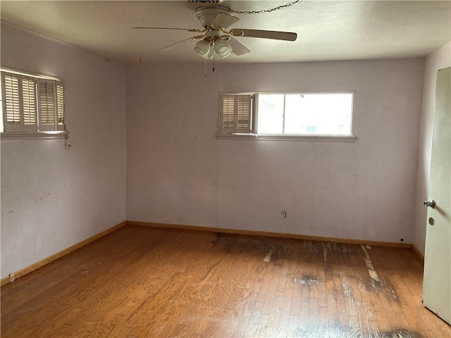 spare room featuring light hardwood / wood-style floors and ceiling fan