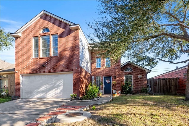 view of front property featuring a front yard and a garage