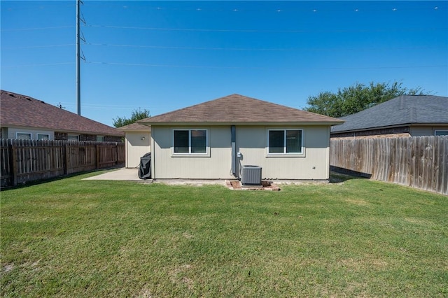 1522 W Nelson Ave, Aransas Pass, TX 78336 - back of property featuring central AC unit and a shingled roof