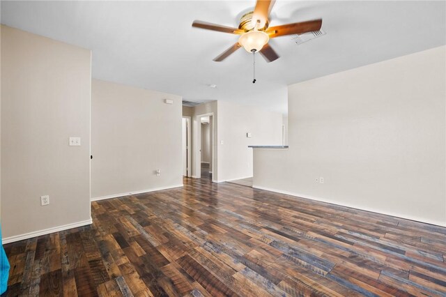 1522 W Nelson Ave, Aransas Pass, TX 78336 - spare room with ceiling fan, wood finished floors, and baseboards