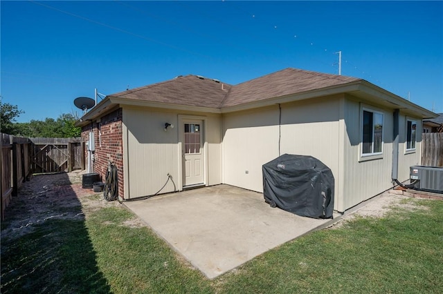 1522 W Nelson Ave, Aransas Pass, TX 78336 - rear view of property featuring central AC, a patio, and roof with shingles