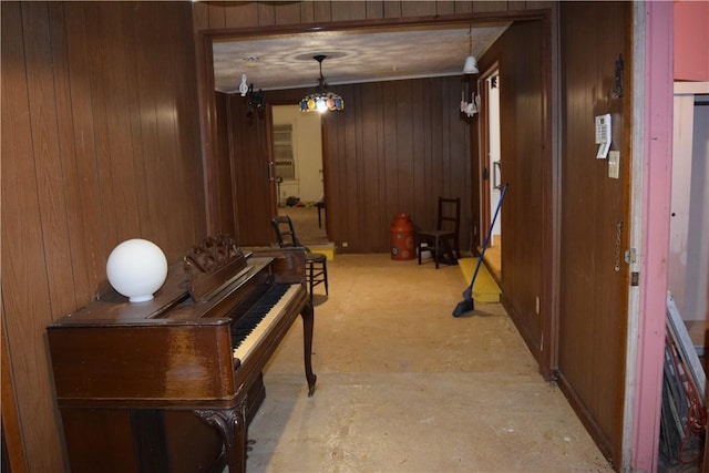 hallway with wood walls