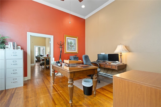 office featuring ceiling fan, hardwood / wood-style floors, and ornamental molding