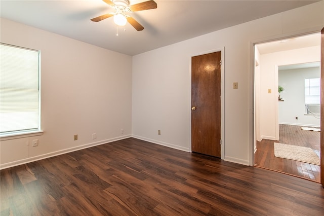 spare room featuring dark hardwood / wood-style floors and ceiling fan