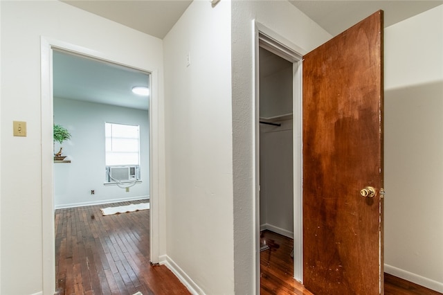 hallway featuring dark wood-type flooring and cooling unit