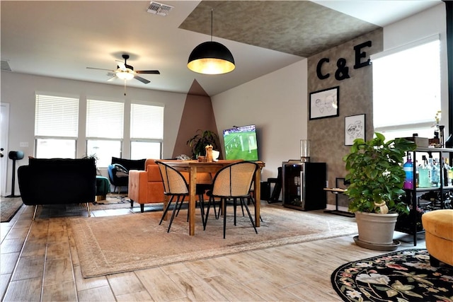 dining room featuring wood-type flooring and ceiling fan