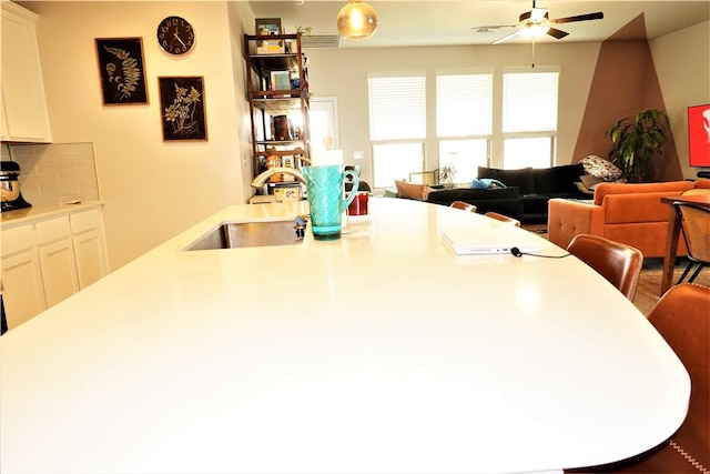 dining room with sink and ceiling fan