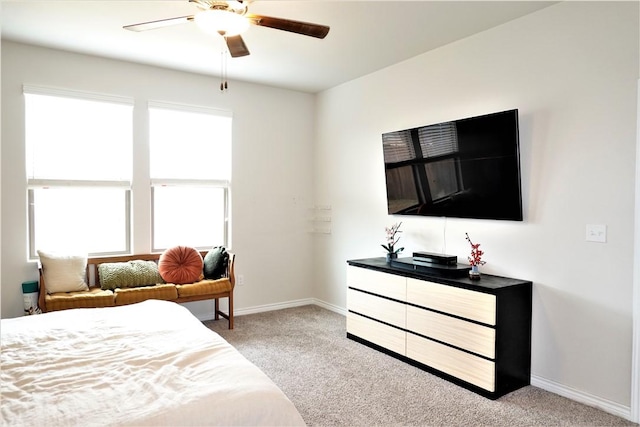 bedroom featuring light colored carpet and ceiling fan