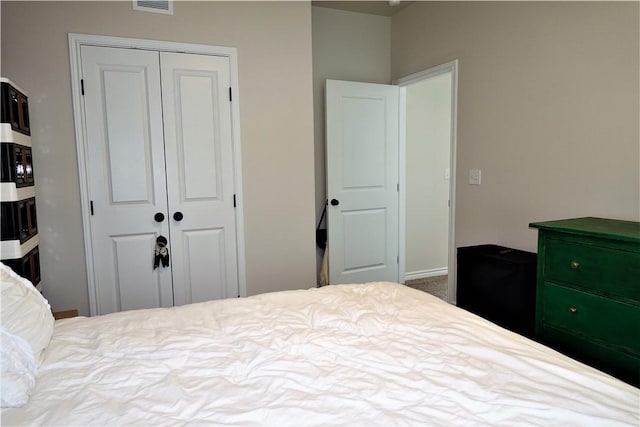 carpeted bedroom featuring a closet